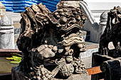 Bangkok Wat Arun - Detail of the precint of the sacred area of the ubosot. guarded by chinese lions. 